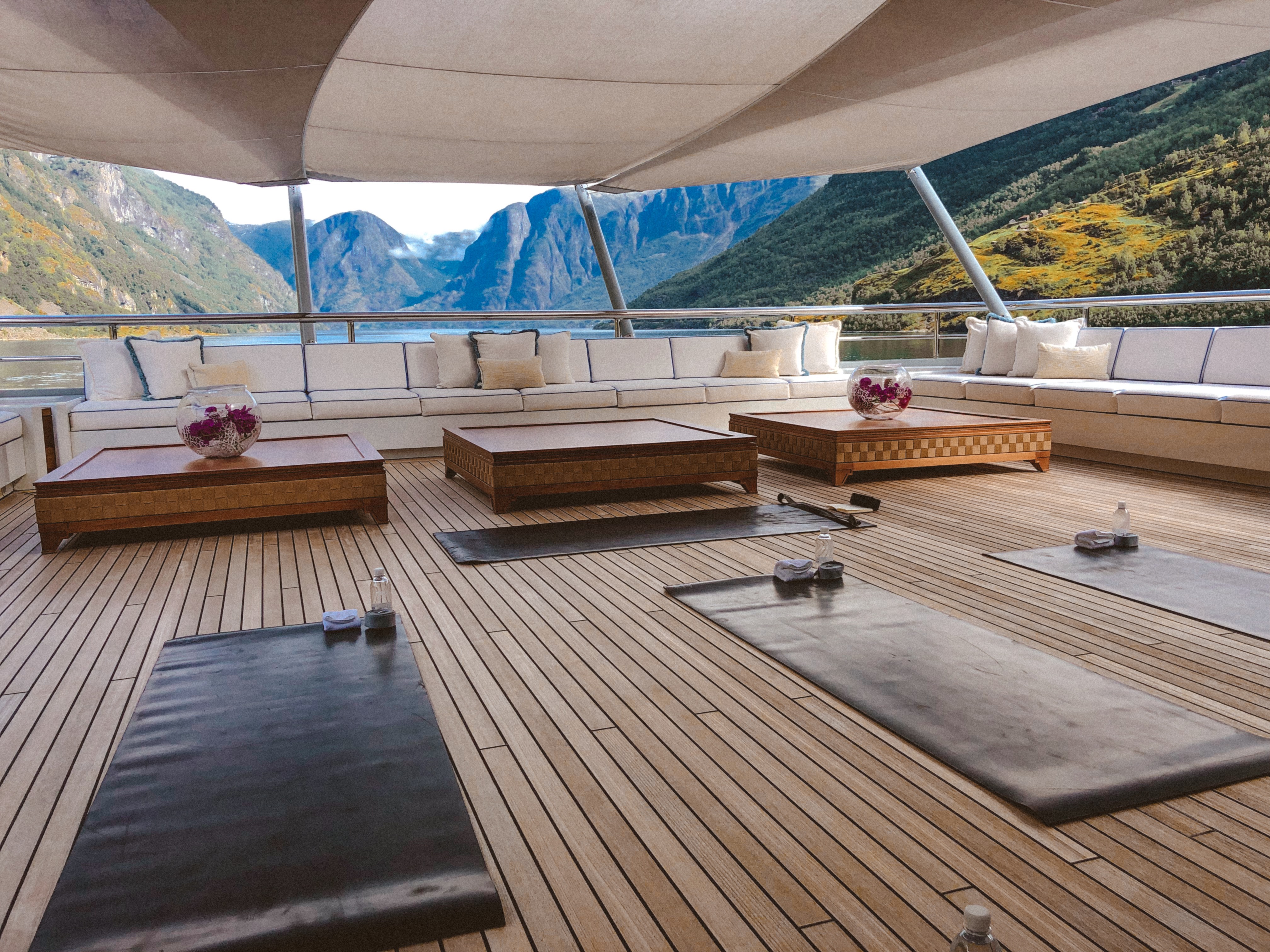 Yoga retreat deck overlooking mountain fjord